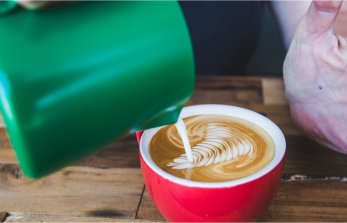 Milk Jug Pouring Textured Milk - Crema Coffee Garage