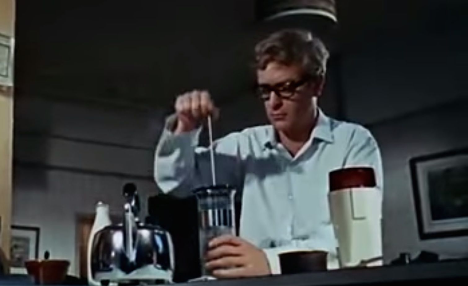 Sir Michael Caine as Tommy Palmer in The Ipcress File (1965) Using the Insta-Brewer